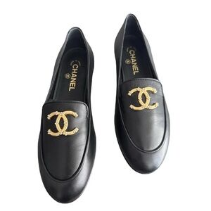 CHANEL Black Flats with Gold Emblem
